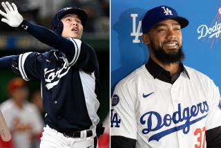 Hyeseong Kim, left, and Teoscar Hernandez