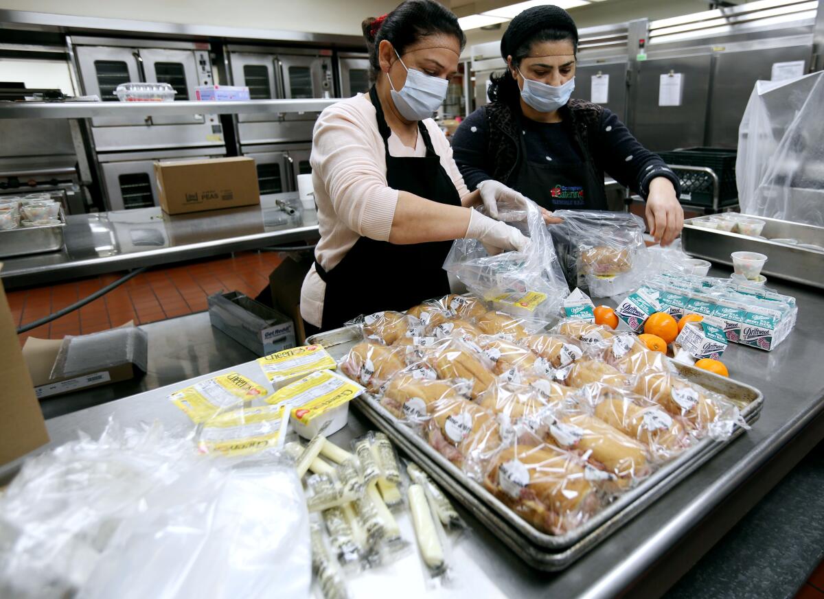 Glendale High cafeteria workers Janet Muradian, left, and Manik Chilgevorgian