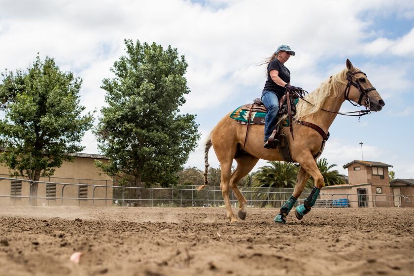 Chula Vista, CA - May 25: Janeen Reed rides her horse Amber at Rohr Park on Thursday, May 25, 2023 in Chula Vista, CA. (Meg McLaughlin / The San Diego Union-Tribune)