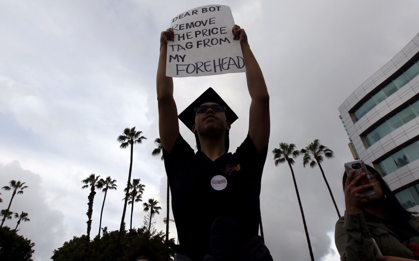 Students from across the California State University's 23 campuses protest proposed tuition increases outside the Cal State trustees meeting Wednesday morning in Long Beach.