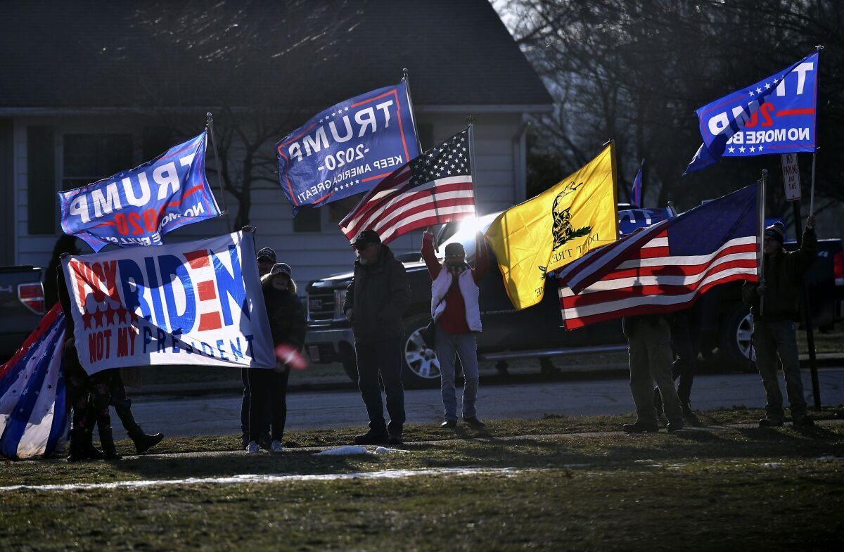 FILE - In this March 3, 2021, file photo, supporters of former President Donald Trump demonstrate outside as first lady Jill Biden and Education Secretary Miguel Cardona visit Fort LeBoeuf Middle School in Waterford, Pa. State Sen. Doug Mastriano, R-Franklin, said in a statement Wednesday, July 7, 2021, that, as chair of the Senate Intergovernmental Operations Committee, he issued letters to several counties, requesting "information and materials needed to conduct a forensic investigation of the 2020 General Election and the 2021 Primary." (Mandel Ngan/Pool Photo via AP, File)