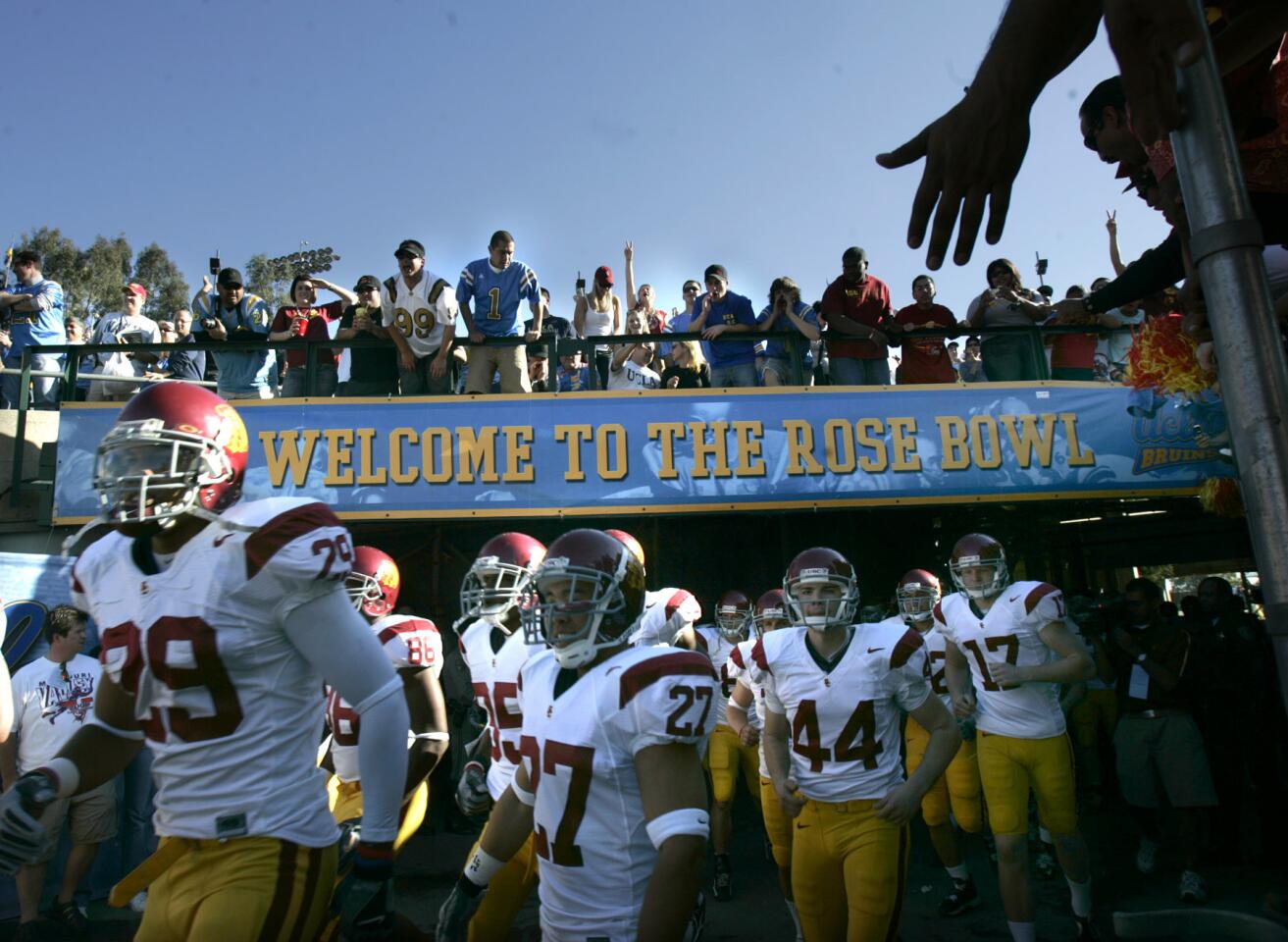 USC players run out on to the field before the game against UCLA at the Rose Bowl in Pasadena on Dec. 2, 2006.