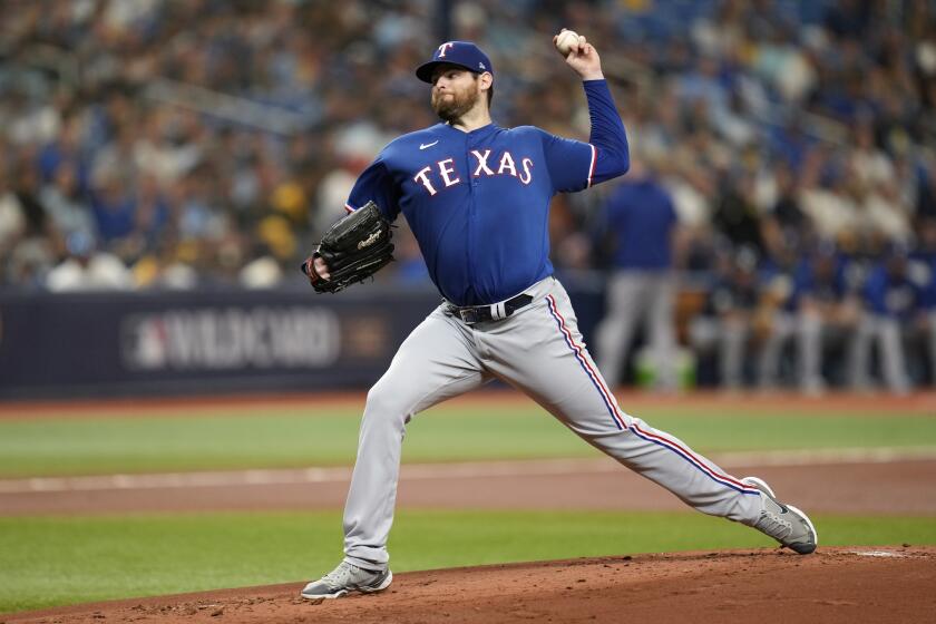 Texas Rangers starting pitcher Jordan Montgomery throws against the Tampa Bay Rays during the first inning of Game 1 in an AL wild-card baseball playoff series game, Tuesday, Oct. 3, 2023, in St. Petersburg, Fla. (AP Photo/John Raoux)