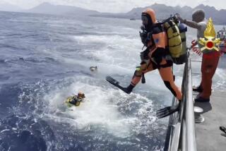 In this frame grab taken from a footage released by the Italian Firefighters Tuesday, Aug. 20, 2024, scuba divers on the scene scene of the search for a missing boat, in Porticello, southern Italy. Rescue teams and divers returned to the site of a storm-sunken superyacht Tuesday to search for six people, including British tech magnate Mike Lynch, who are believed to be still trapped in the hull 50 meters (164-feet) underwater. (Italian Firefighters via AP, HO)