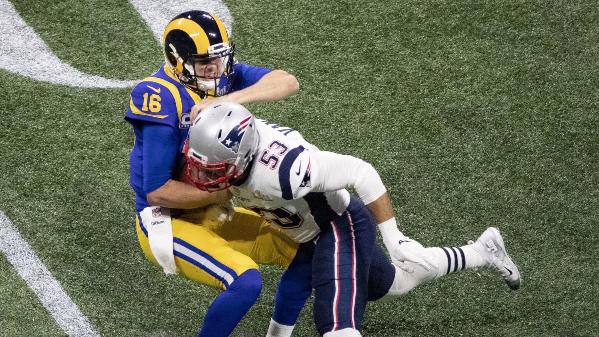 New England Patriots middle linebacker Kyle Van Noy tackles Rams quarterback Jared Goff in the first half of the Super Bowl in Atlanta.