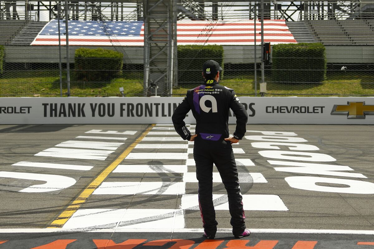 FILE - In this June 28, 2020, file photo, Jimmie Johnson stands at Pocono Raceway in Long Pond, Pa. 