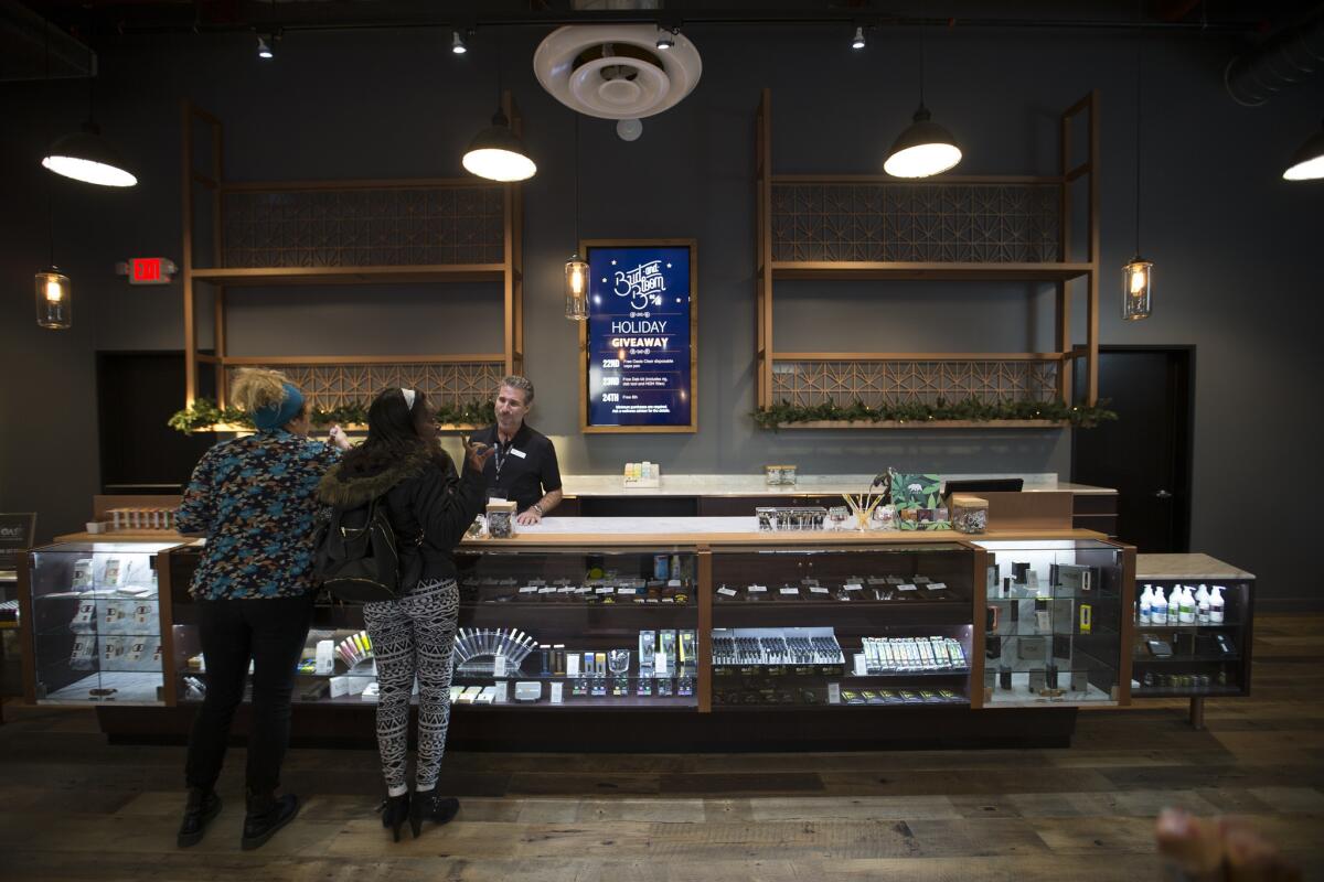 Patrons shop at Bud and Bloom, a Santa Ana marijuana dispensary.