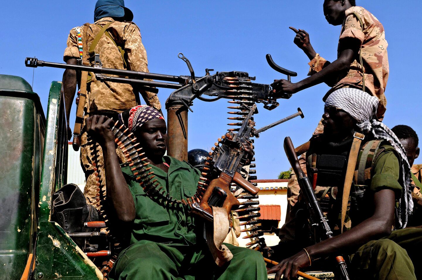 Soldiers in the Sudan People's Liberation Army patrol the streets in a pickup truck after capturing the town of Bentiu. The ethnic killings that began in South Sudan last December claimed an estimated 10,000 lives.