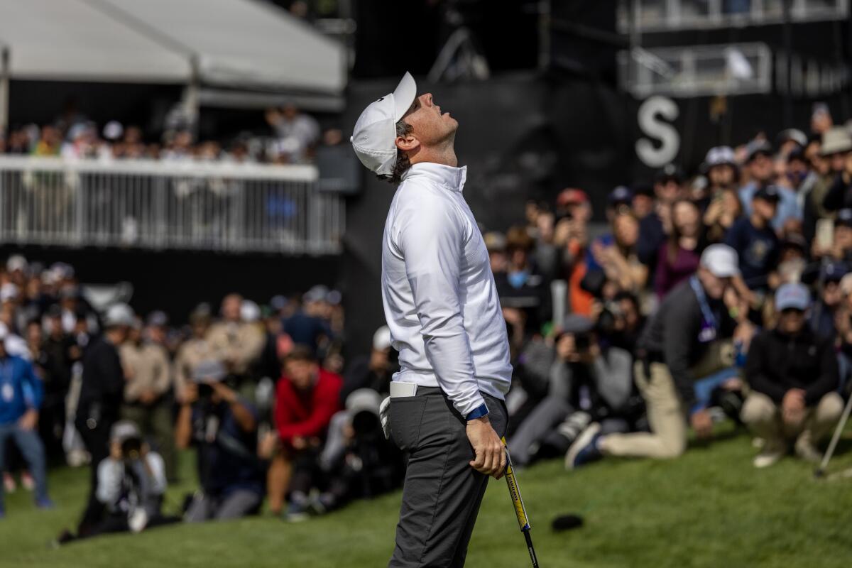 Rory McIlroy lets out a sigh of relief after making a birdie putt on the ninth hole during the second round.