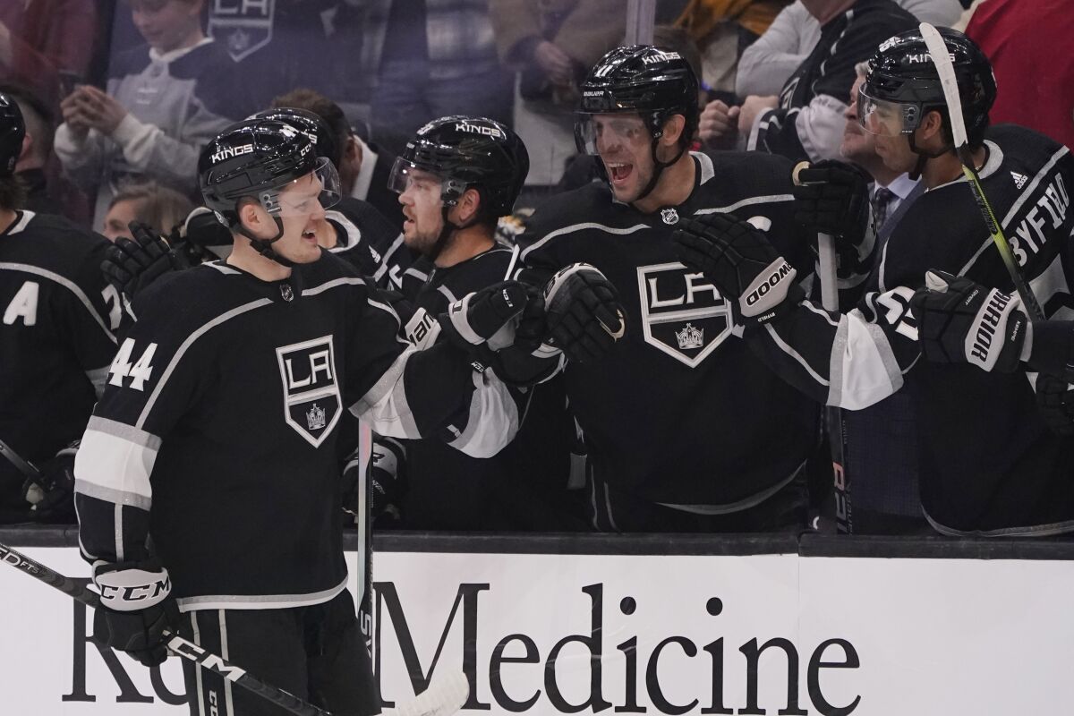 Kings defenseman Mikey Anderson celebrates his goal with teammates after scoring against the Predators on March 11, 2023.