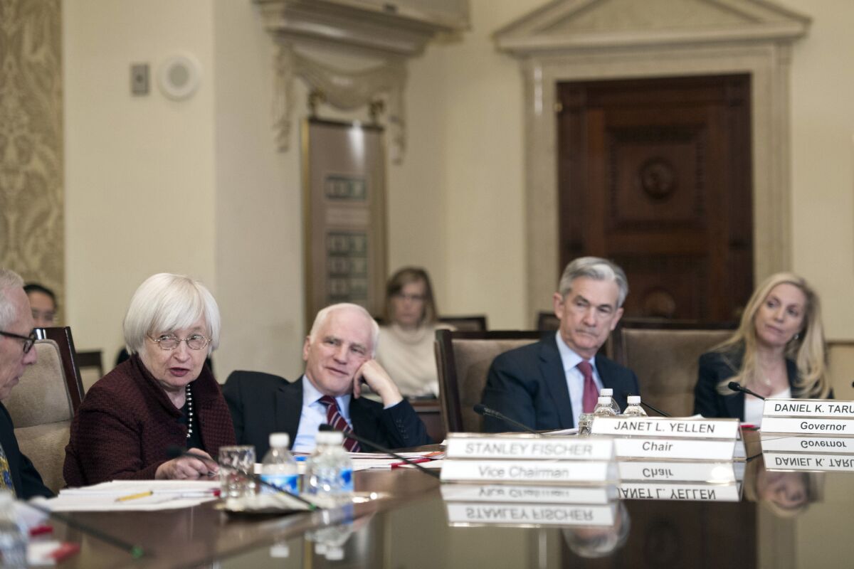 Federal Reserve Chairwoman Janet L. Yellen, second from left, oversees a meeting of the central bank's Board of Governors in Washington on Dec. 15. Some lawmakers and advocacy groups have complained the Fed board and its regional bank presidents lack racial and ethnic diversity.