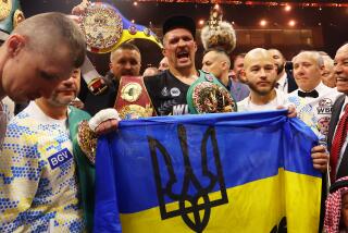 RIYADH, SAUDI ARABIA - MAY 18: Oleksandr Usyk holds a Ukrainian flag as he celebrates with the Undisputed Heavyweight title belt following victory over Tyson Fury (not pictured) in the IBF, WBA, WBC, WBO and Undisputed Heavyweight titles' fight between Tyson Fury and Oleksandr Usyk at Kingdom Arena on May 18, 2024 in Riyadh, Saudi Arabia. (Photo by Richard Pelham/Getty Images)