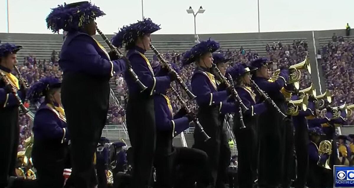 Some East Carolina band members kneel in protest while playing the national anthem on Oct. 1.
