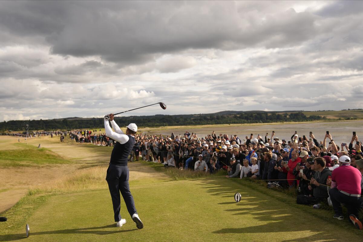 Tiger Woods plays from the 12th tee during the first round of the British Open on Thursday on the Old Course at St Andrews.
