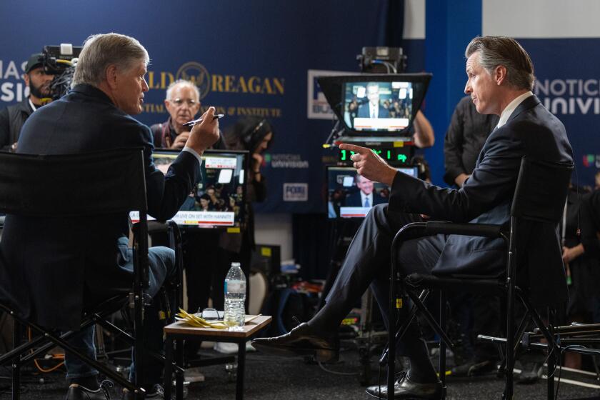 SIMI VALLEY, CA - SEPTEMBER 27: California Gov. Gavin Newsom, right, does an interview with Sean Hannity following the second GOP Presidential debate at the Ronald Reagan Presidential Library in Simi Valley, CA on Wednesday, Sept. 27, 2023. (Myung J. Chun / Los Angeles Times)