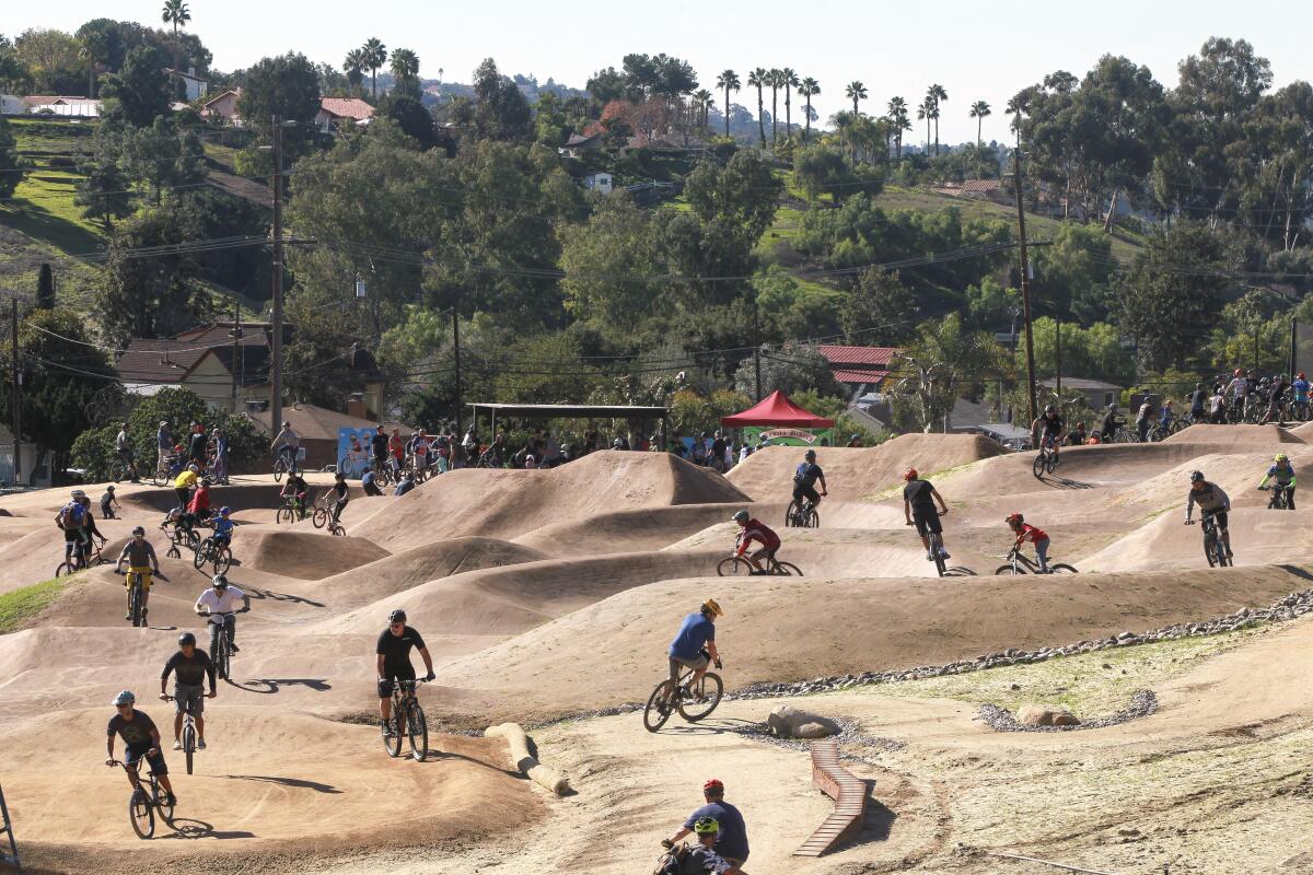 Mountain bike and BMX riders try out the Sweetwater Bike Park, the first of its kind for the County of San Diego Department of Parks and Recreation, during the grand opening on Saturday in Bonita. 
