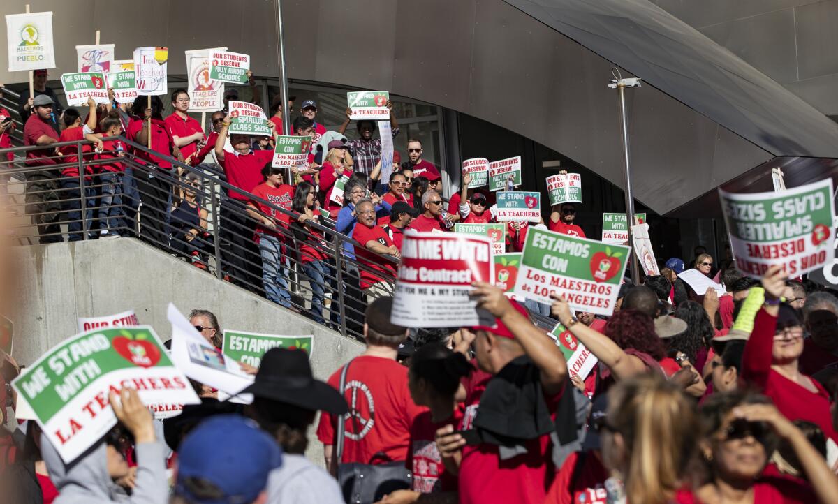 Protesters line the stairs at Disney Hall to join the teachers march on Grand Avenue.