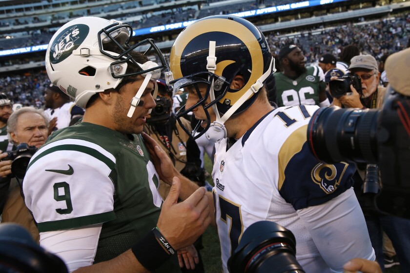 Rams quarterback Case Keenum offers encouraging words to Jets rookie quarterback Bryce Petty after the Rams' victory on Nov. 13. It was the last game that Keenum started.