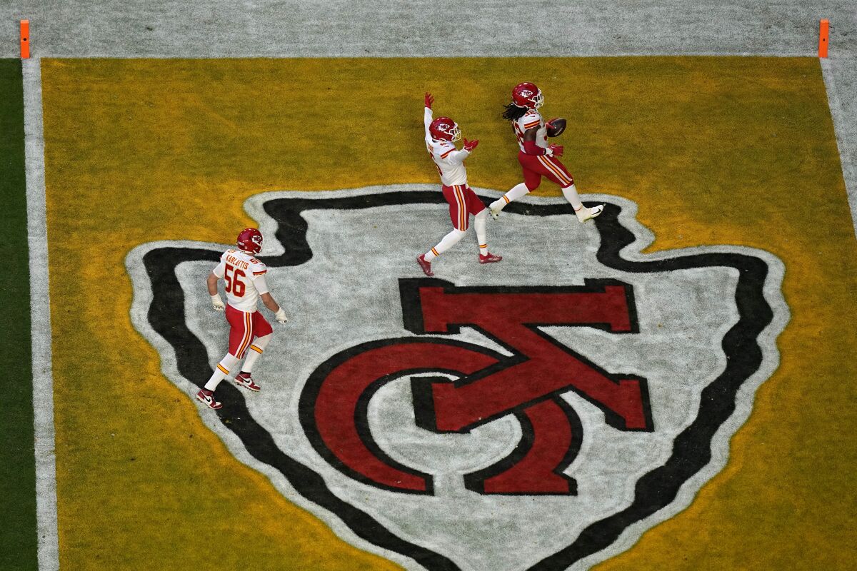 Kansas City Chiefs linebacker Nick Bolton scores on a fumble return in the first half Sunday.