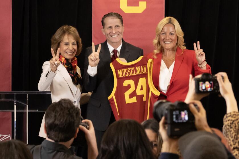 LOS ANGELES, CA- APRIL 05: USC President Carol Folt, left, Eric Musselman and Athletic Director.