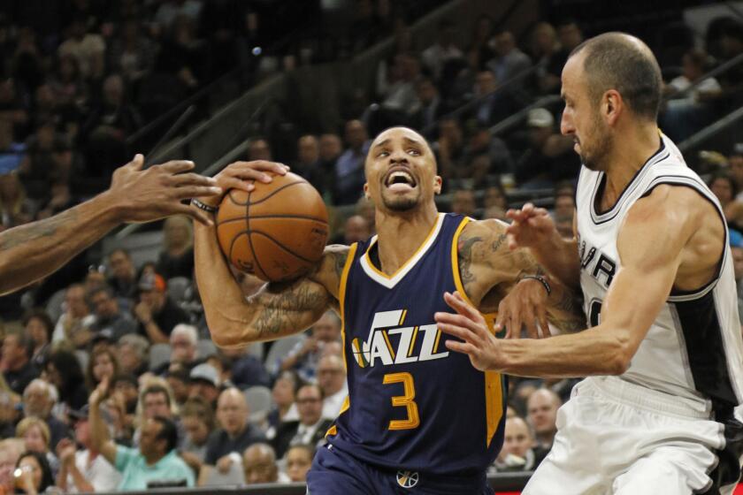 Jazz guard George Hill (3) drives on Spurs veteran Manu Ginobili (20) on Nov. 1.