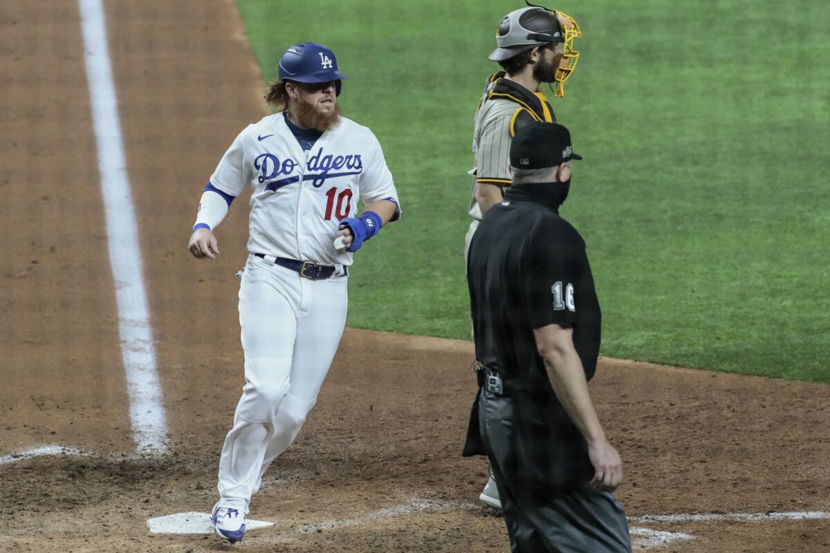 Dodgers third baseman Justin Turner scores in the fifth inning in Game 1 of the NLDS at Globe Life Field.