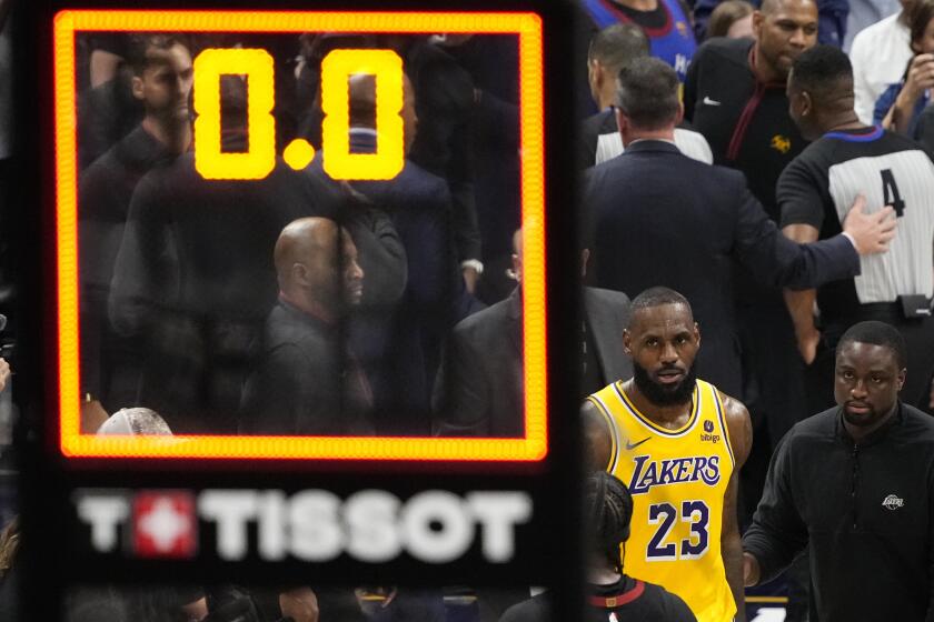 Los Angeles Lakers forward LeBron James (23) walks off the court after a loss to the Denver Nuggets.