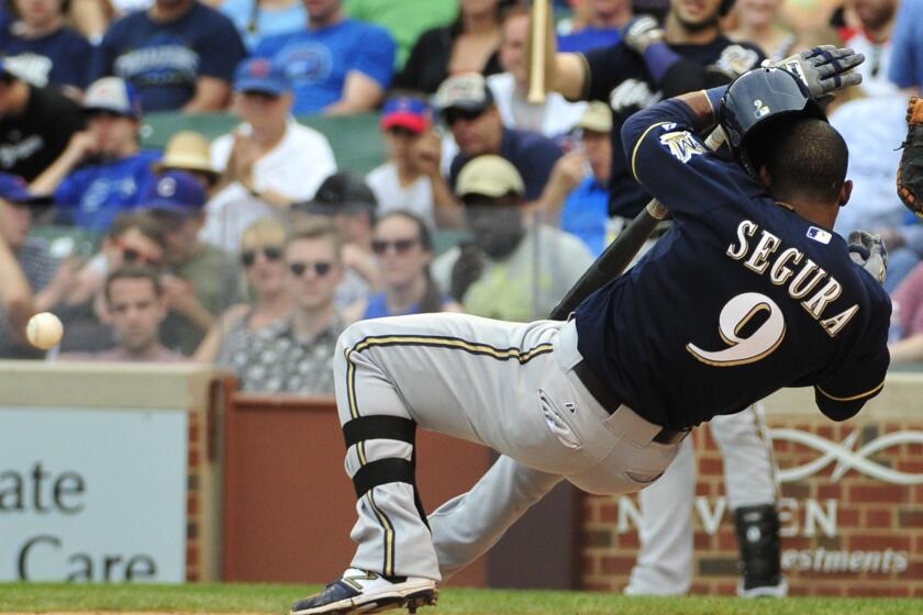 Brewers shortstop Jean Segura reacts after getting hit by a pitch against the Cubs in the eighth inning.