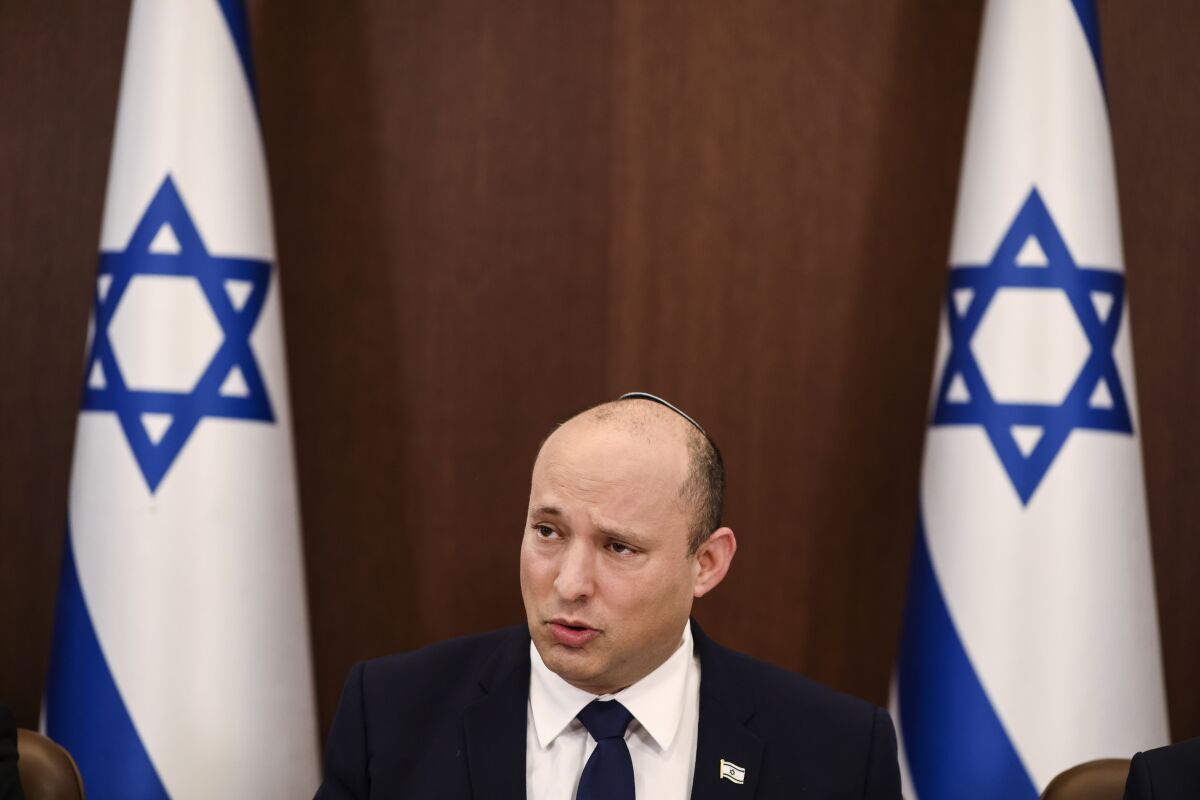 FILE - In this Oct. 5, 2021 file photo, Israeli Prime Minister Naftali Bennett speaks at the weekly cabinet meeting in Jerusalem. At a conference in Jerusalem on Tuesday, Oct. 12, 2021, Bennett called on the United Nations Security Council to take action against Iran over its escalating nuclear program. (Ronen Zvulun/Pool via AP, File)