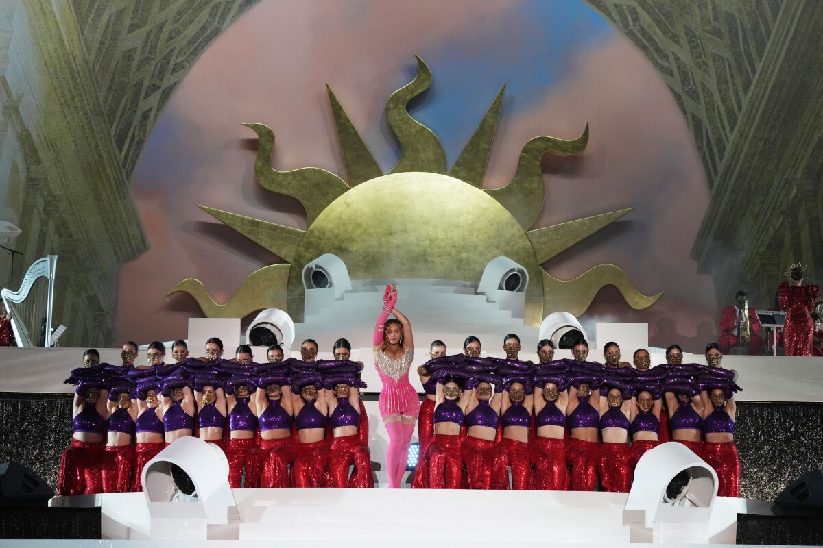 Beyonce performing on stage surrounded by dancers