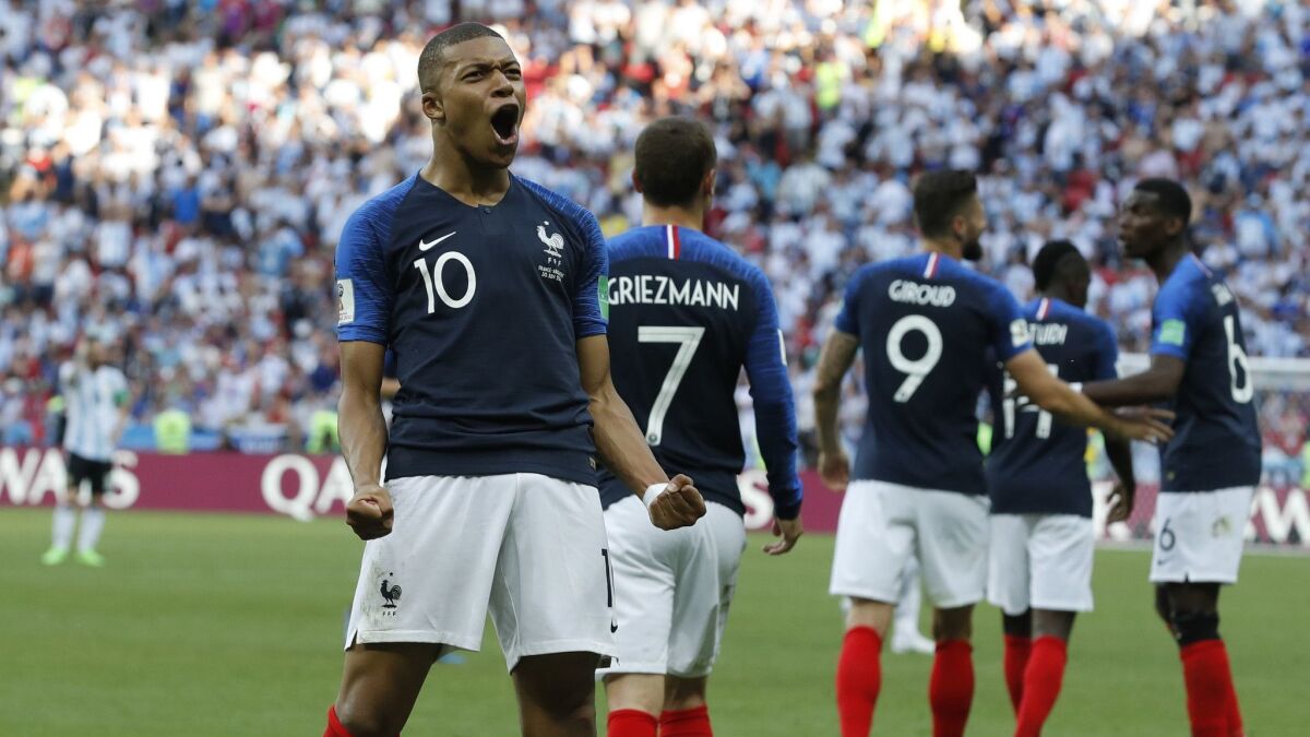 France's Kylian Mbappe celebrates after scoring his side's third goal during their round of 16 match against Argentina at the World Cup on June 30.