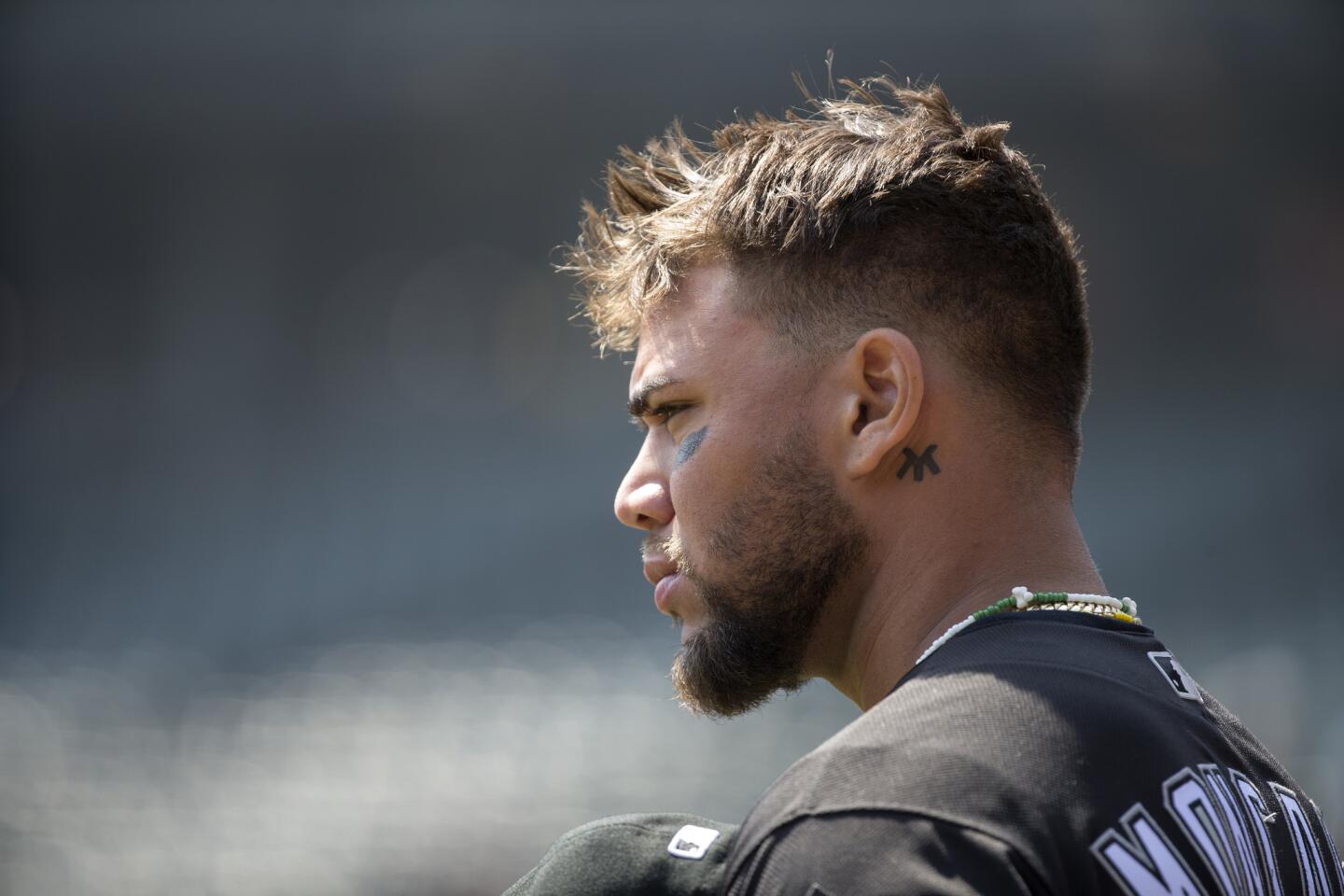 Yoan Moncada (10) stands for the National Anthem before the Chicago White Sox versus Tampa Bay Rays game Wednesday, April 11, 2018, at Guaranteed Rate Field in Chicago.