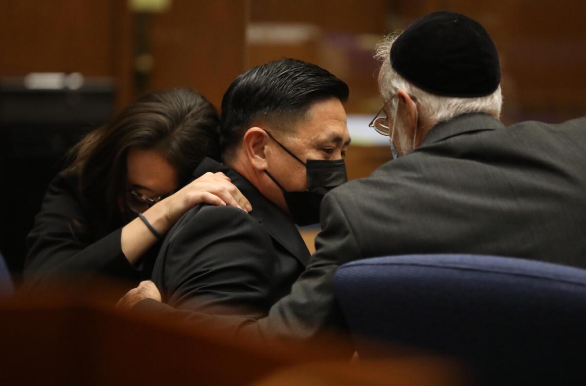 Los Angeles County Sheriff Deputy Luke Liu reacts along with attorney Nicole R. Castronovo.