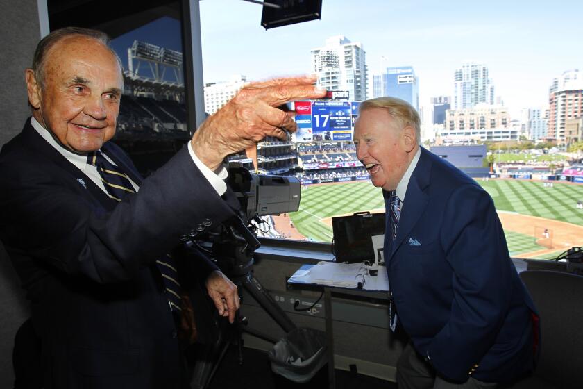 Padres announcer Dick Enberg andDodgers announcer Vin Scully chat before an Opening Day 2015 at Petco Park.