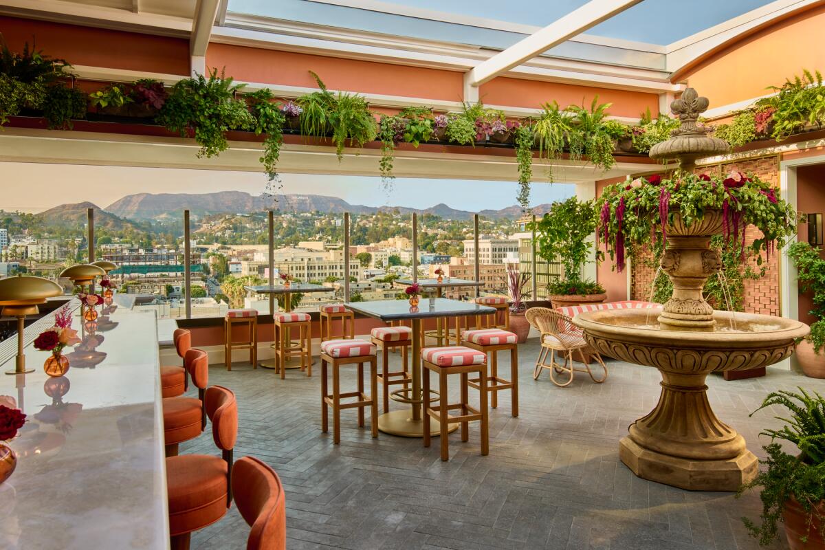 A Mediterranean-style bar with views of L.A. seen through the windows