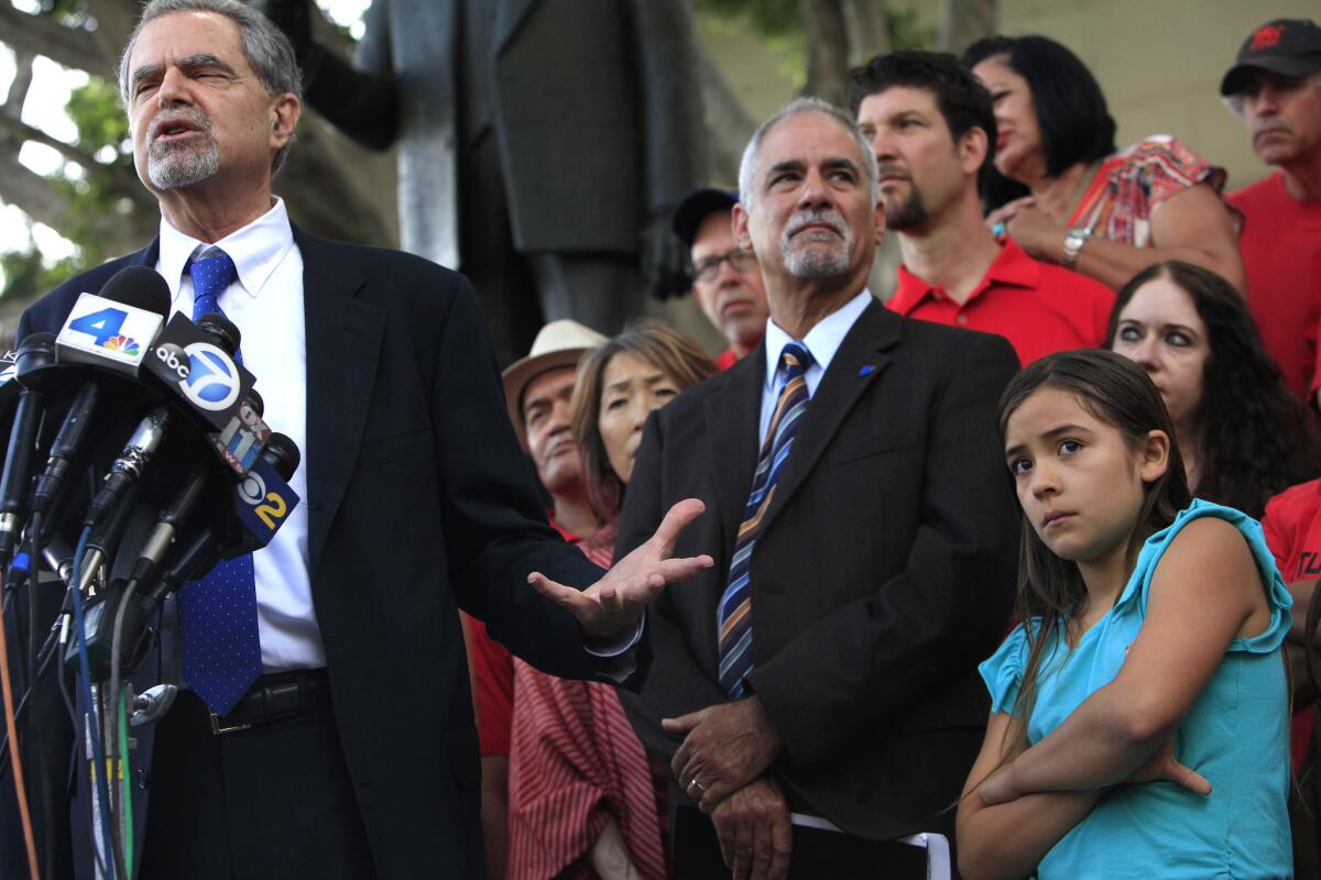 Josh Pechthalt, left, president of the California Federation of Teachers, speaks as the California Teacher Assn. holds a press conference about the decision handed down in Vergara vs. California.