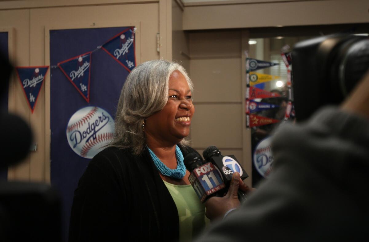 Sharon Robinson is interviewed by the media at Washington Middle School in Pasadena