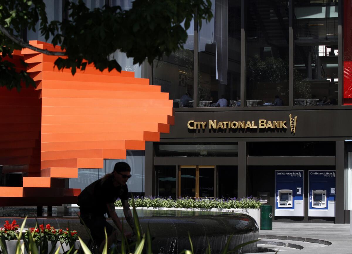 A judge has ruled that downtown L.A.'s City National Bank overcharged its employees' 401(k) retirement plan between 2006 and 2012. The bank plans to fight the ruling.