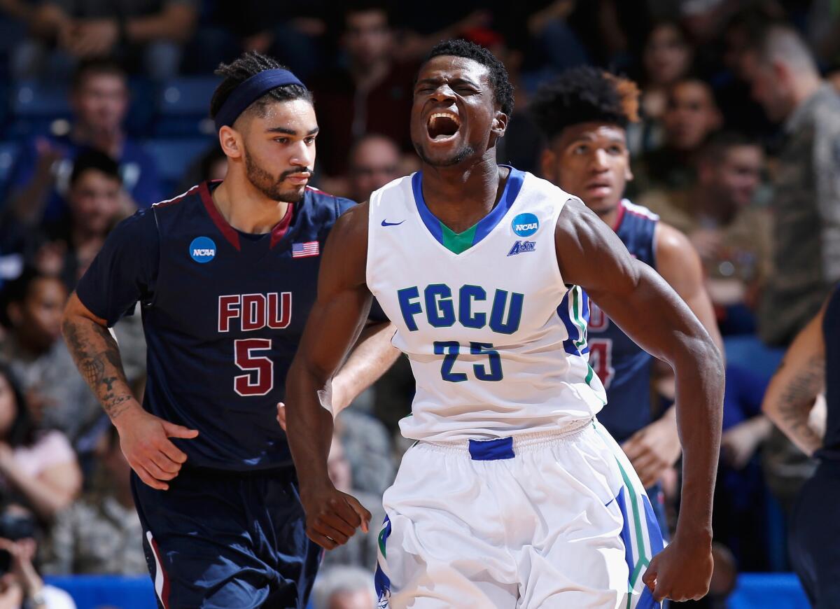 Florida Gulf Coast forward Marc Eddy Norelia reacts after a basket in the first half against Fairleigh Dickinson.