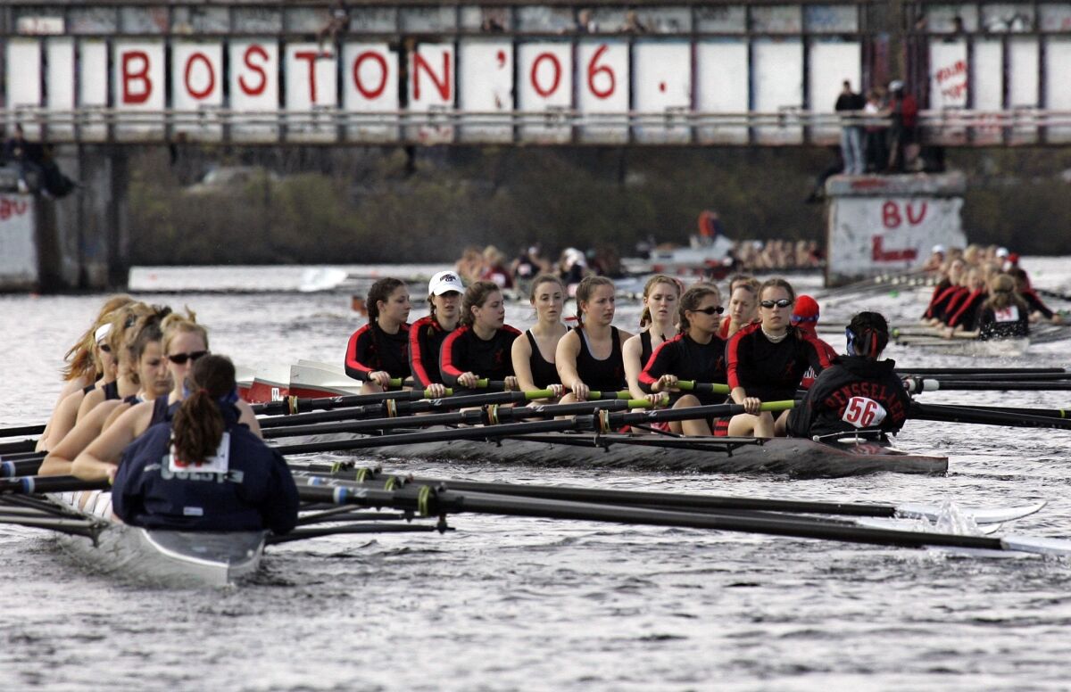 FILE - Competitors head to the starting line for Collegiate Women's Eights during the Head of the Charles Regatta in Cambridge, Mass., Sunday, Oct. 22, 2006. This month marks the 50th anniversary of the Title IX law that requires equitable treatment of men and women in educational programs that receive federal assistance. (AP Photo/Chitose Suzuki, File)