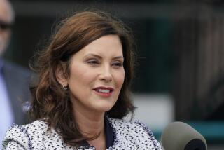 Michigan Gov. Gretchen Whitmer addresses the media after signing the final piece of a $76 billion state budget into law, July 20, 2022. (AP Photo/Carlos Osorio)