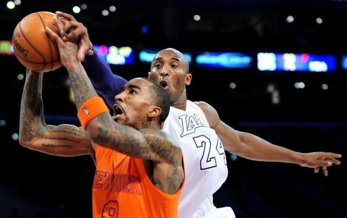 Kobe Bryant, here blocking a shot by J.R. Smith of the Knicks, is the leading vote-getter in the fan balloting for the All-Star Game.