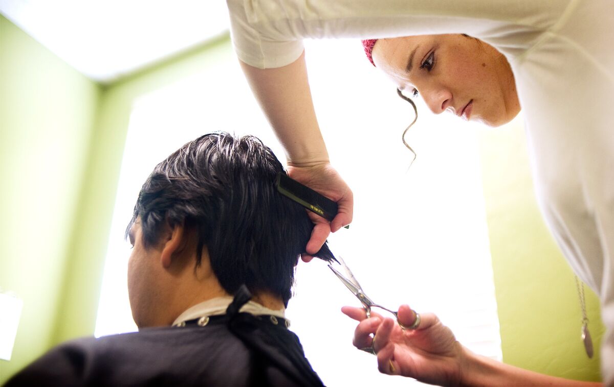 A Marinello Schools of Beauty student cuts hair in Provo, Utah, in 2010.