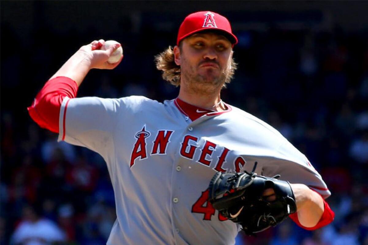 Angels' Kevin Jepsen pitches in the seventh inning against the Texas Rangers.