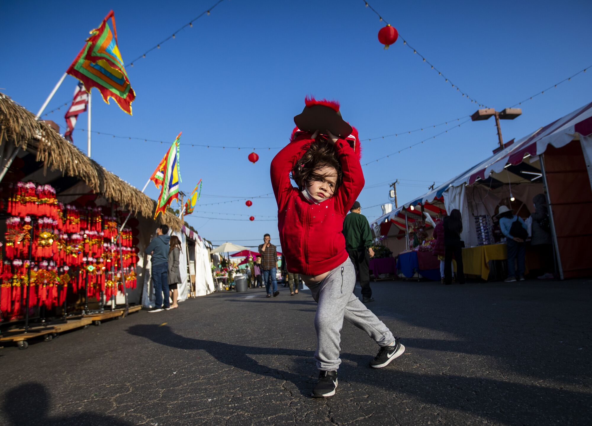Midori Nguyen, 5, of Westminster performs the lion dance
