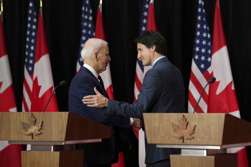 U.S. President Joe Biden and Canada's Prime Minister Justin Trudeau embrace following a joint news conference, in Ottawa, Ontario, Friday, March 24, 2023. (Sean Kilpatrick/The Canadian Press via AP)