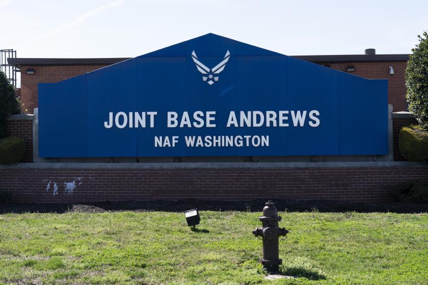 FILE - The sign for Joint Base Andrews is seen on March 26, 2021, at Andrews Air Force Base, Md. A wayward and unresponsive business jet that flew over the nation's capital Sunday afternoon, June 4, 2023, caused the military to scramble a fighter plane from Joint Base Andrews before the jet crashed in Virginia, officials said. The fighter jet caused a loud sonic boom that was heard across the capital region. (AP Photo/Alex Brandon, File)