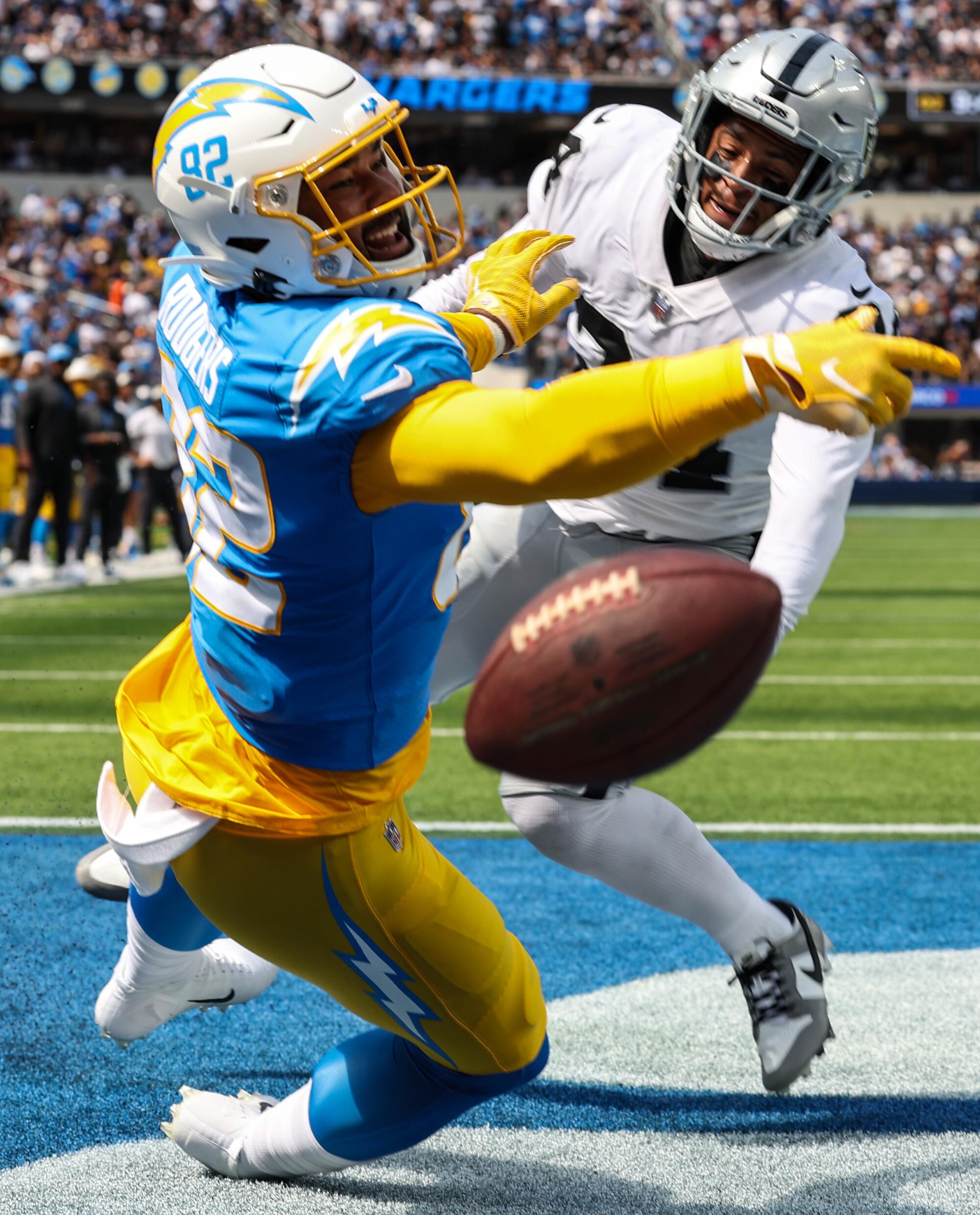 Chargers tight end Richard Rodgers misses a potential touchdown pass while defended by Raiders safety Johnathan Abram.