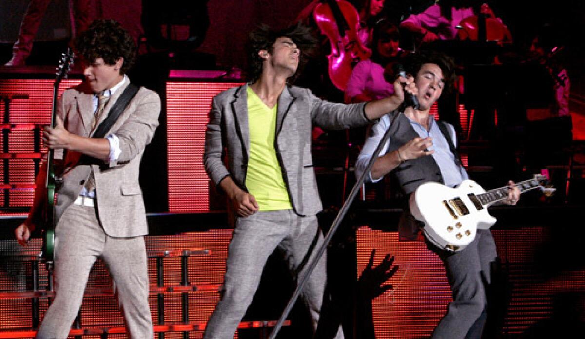 YOUTH SERVED: The Jonas Brothers deliver their music to the young girls who cant holler and text-message enough.