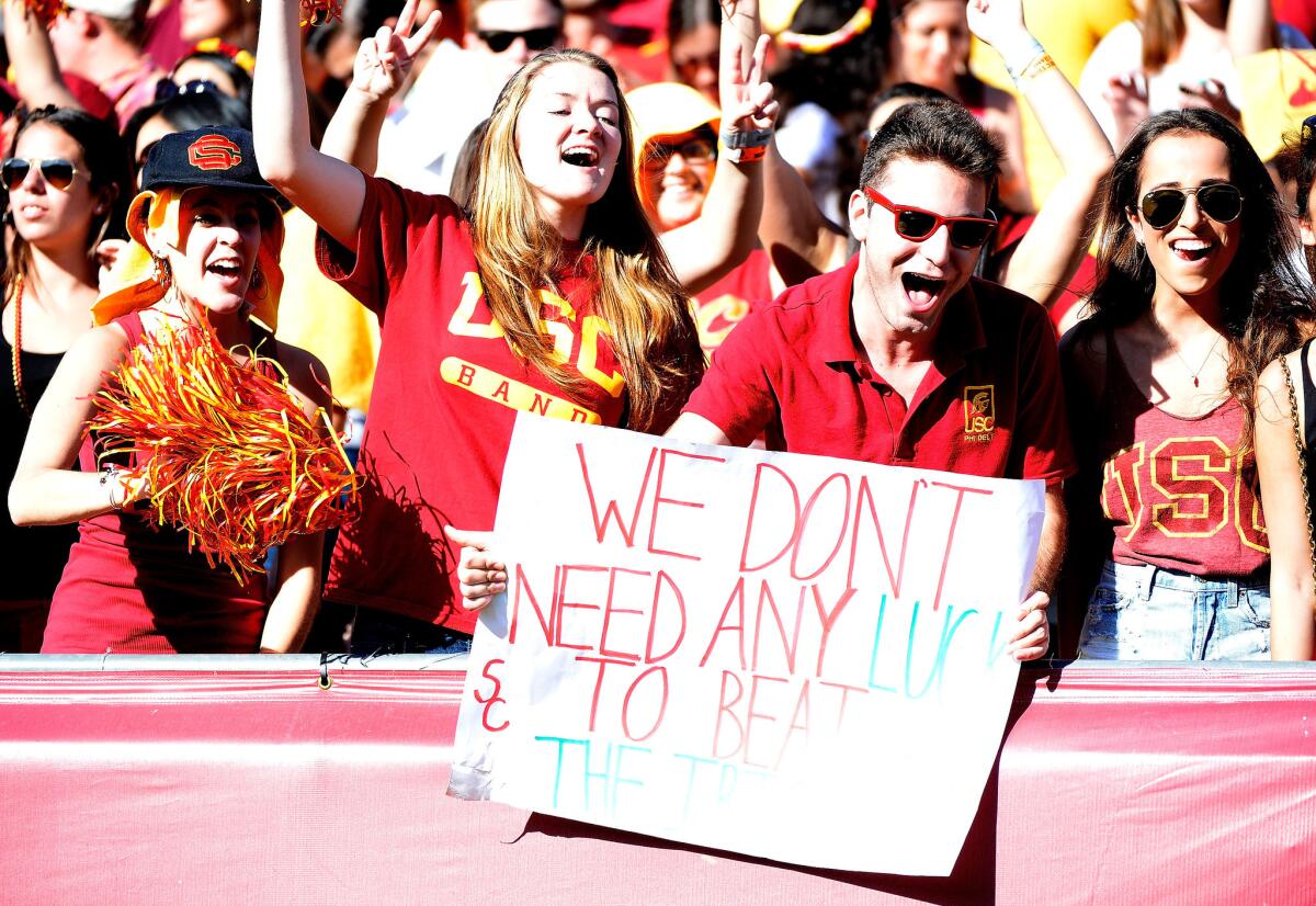 USC fans celebrate during the Trojans' 49-14 win over Notre Dame on Nov. 29 at the Coliseum.